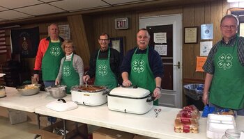 folks at dinner serving food